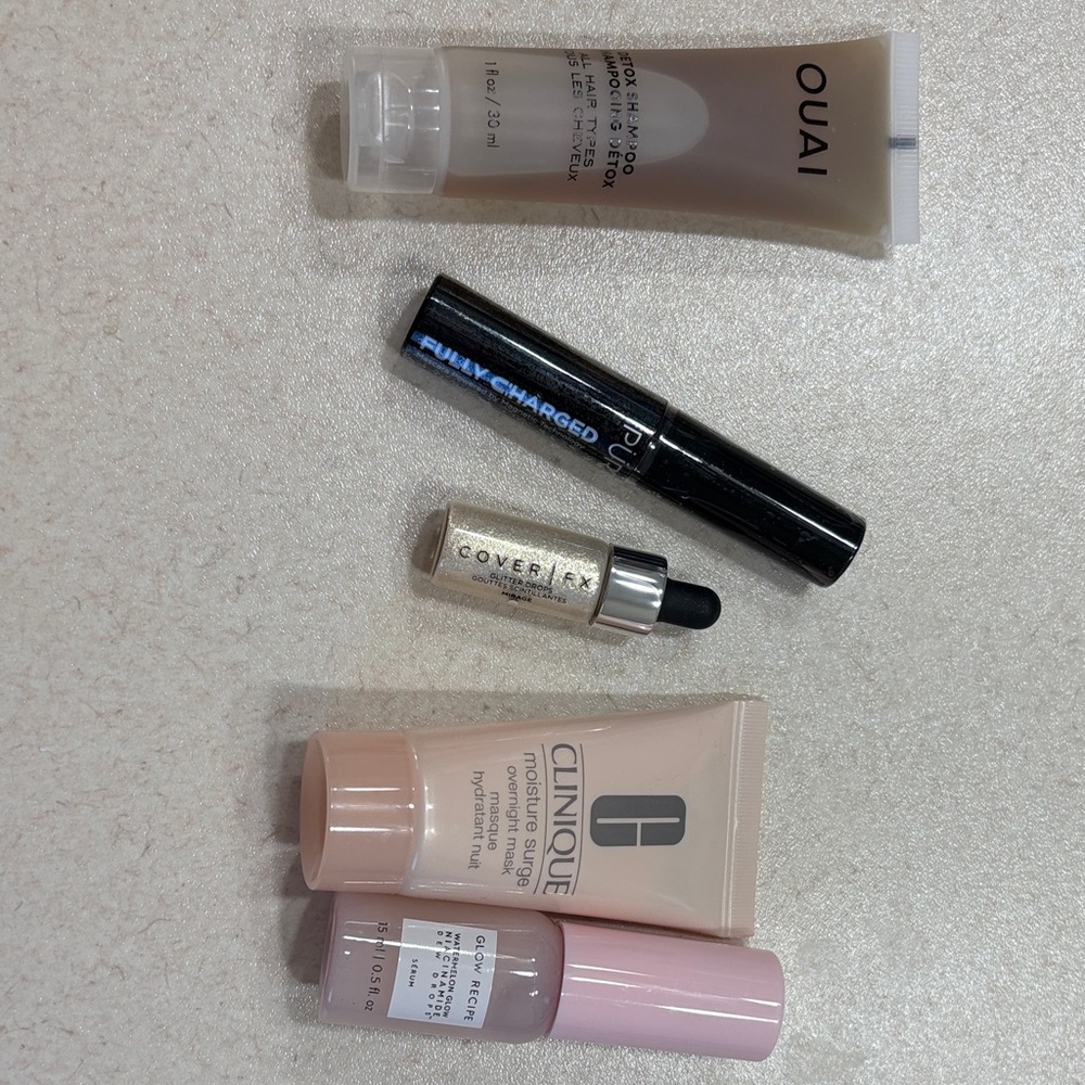 Variety of travel sizes for skincare, makeup, and hair